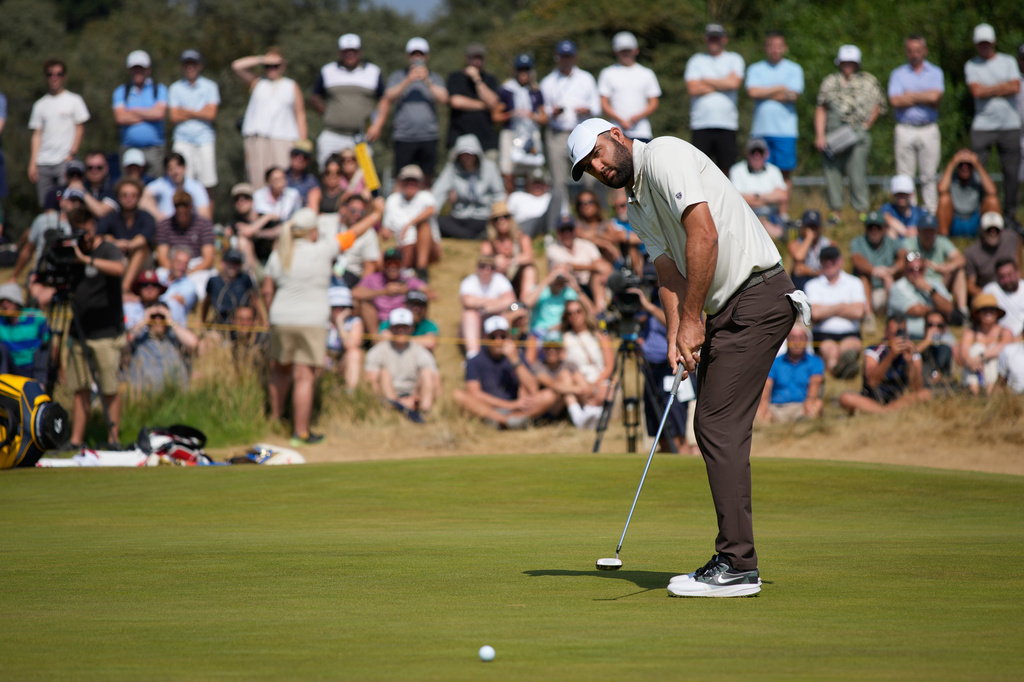 Scottie Scheffler of the United States putts on the 1st green during the second day of the British Open Golf championships at Royal Birkdale golf club, in Southport, England, Friday, July 17, 2026. (AP Photo/David Goldman)