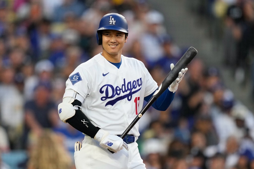 Los Angeles Dodgers' Shohei Ohtani smiles toward the San Francisco Giants' dugout as he walks up to bat during the first inning of a baseball game Tuesday, May 12, 2026, in Los Angeles. (AP Photo/Mark J. Terrill)