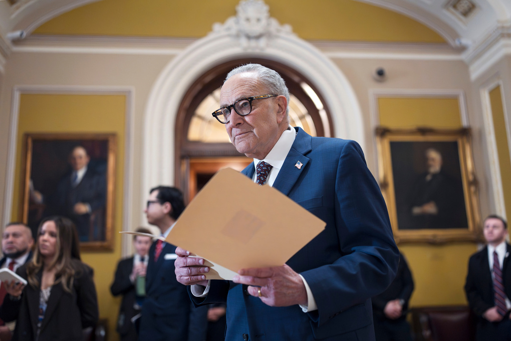 FILE—Senate Minority Leader Chuck Schumer, D-N.Y., waits to speak to reporters following a closed-door meeting with fellow Democrats on spending legislation that funds the Department of Homeland Security and a swath of other government agencies as the country reels from the deaths of two people at the hands of federal agents in Minneapolis, at the Capitol in Washington, Wednesday, Jan. 28, 2026. (AP Photo/J. Scott Applewhite, File)
