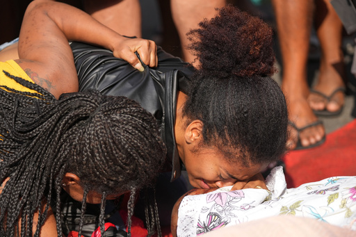 Relatives mourn beside the bodies of people killed the day before during a police raid targeting the Comando Vermelho gang in the Complexo da Penha favela of Rio de Janeiro, Brazil, Wednesday, Oct. 29, 2025. (AP Photo/Silvia Izquierdo) Relatives mourn beside the bodies of people killed the day before during a police raid targeting the Comando Vermelho gang in the Complexo da Penha favela of Rio de Janeiro, Brazil, Wednesday, Oct. 29, 2025. (AP Photo/Silvia Izquierdo)