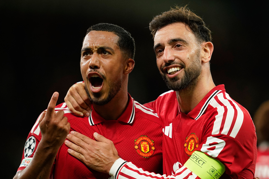 Manchester United's Bruno Fernandes, right, celebrates after scoring his side's second goal with Youri Tielemans, left, during the Champions League opening phase soccer match between Manchester United and Sabah FK in Manchester, England, Thursday, Sept. 10, 2026. (AP Photo/Dave Thompson)