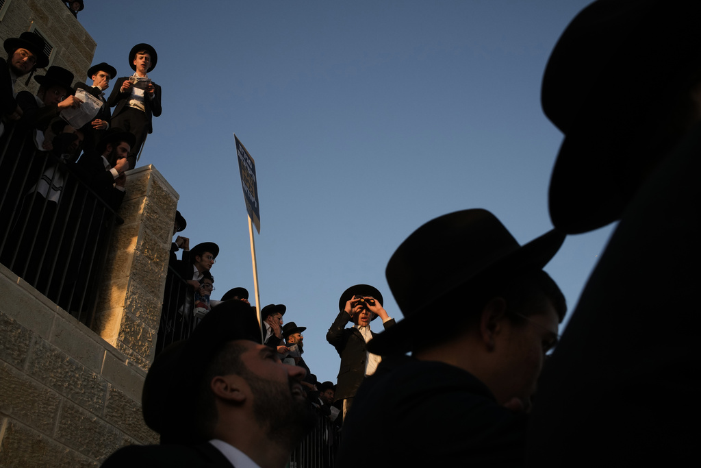 Ultra-Orthodox Jewish men attend a rally against plans to force them to serve in the Israeli military, in Jerusalem, Thursday, Oct. 30, 2025. (AP Photo/Leo Correa)