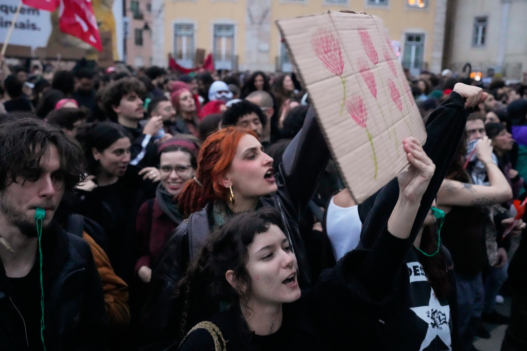 Demonstrators gather outside the parliament during a general strike to protest against a new labour package announced by the centre-right government, in Lisbon, Thursday, Dec. 11, 2025. (AP Photo/Armando Franca)