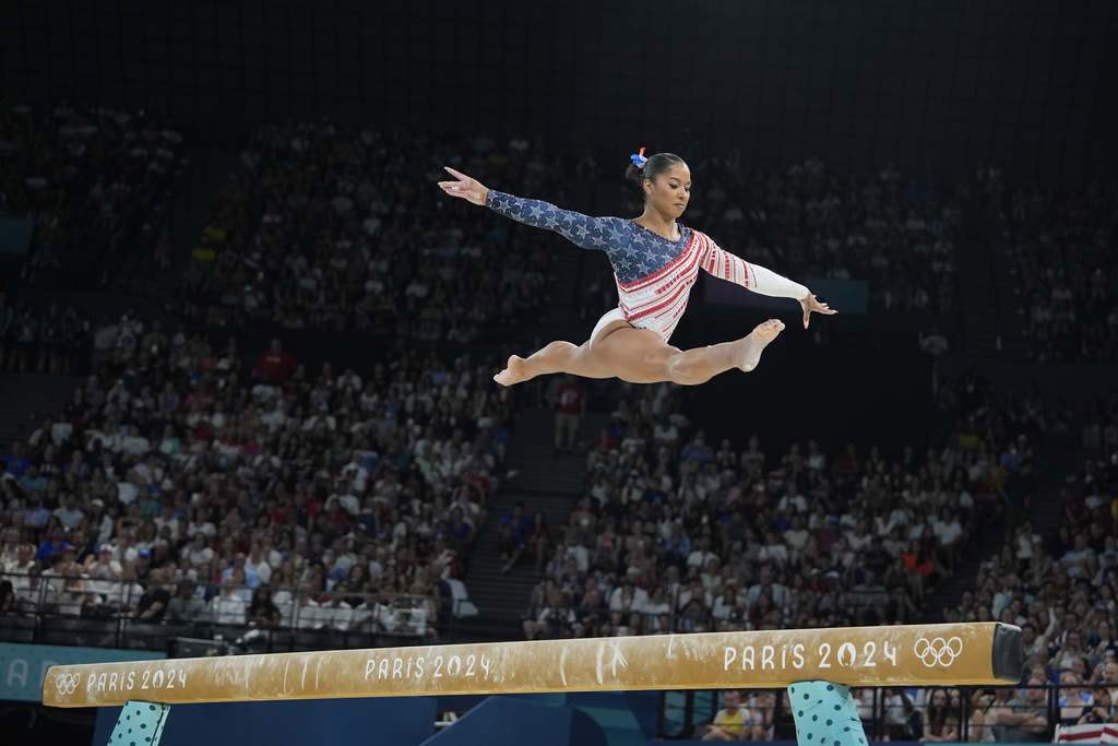 Jordan Chiles, of the United States, performs on the balance beam during the women's artistic gymnastics team finals round at Bercy Arena at the 2024 Summer Olympics, Tuesday, July 30, 2024, in Paris, France. (AP Photo/Charlie Riedel)