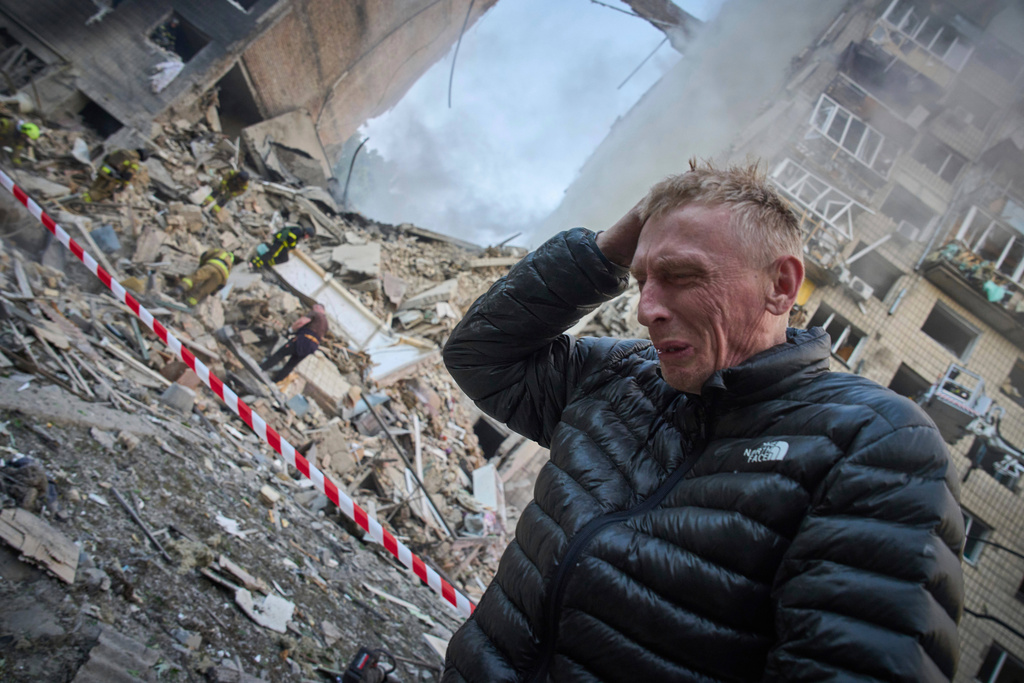 FILE - A resident reacts after a Russian missile hit a multi-storey apartment during Russia's combined missile and drone air attack in Kyiv, Ukraine, June 17, 2025. (AP Photo/Efrem Lukatsky, File)