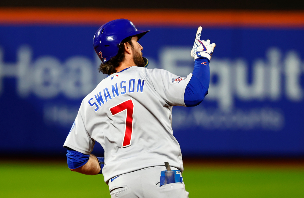 Chicago Cubs' Dansby Swanson (7) reacts while running the bases after hitting a two-run home run against the New York Mets during the fourth inning of a baseball game, Tuesday, June 23, 2026, in New York. (AP Photo/Noah K. Murray)