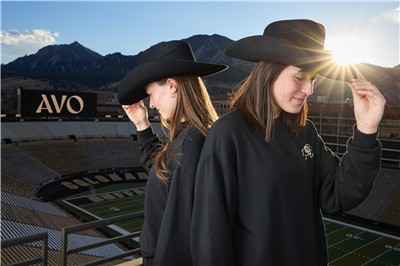 Ralphie Handlers at Folsom Field at sunset