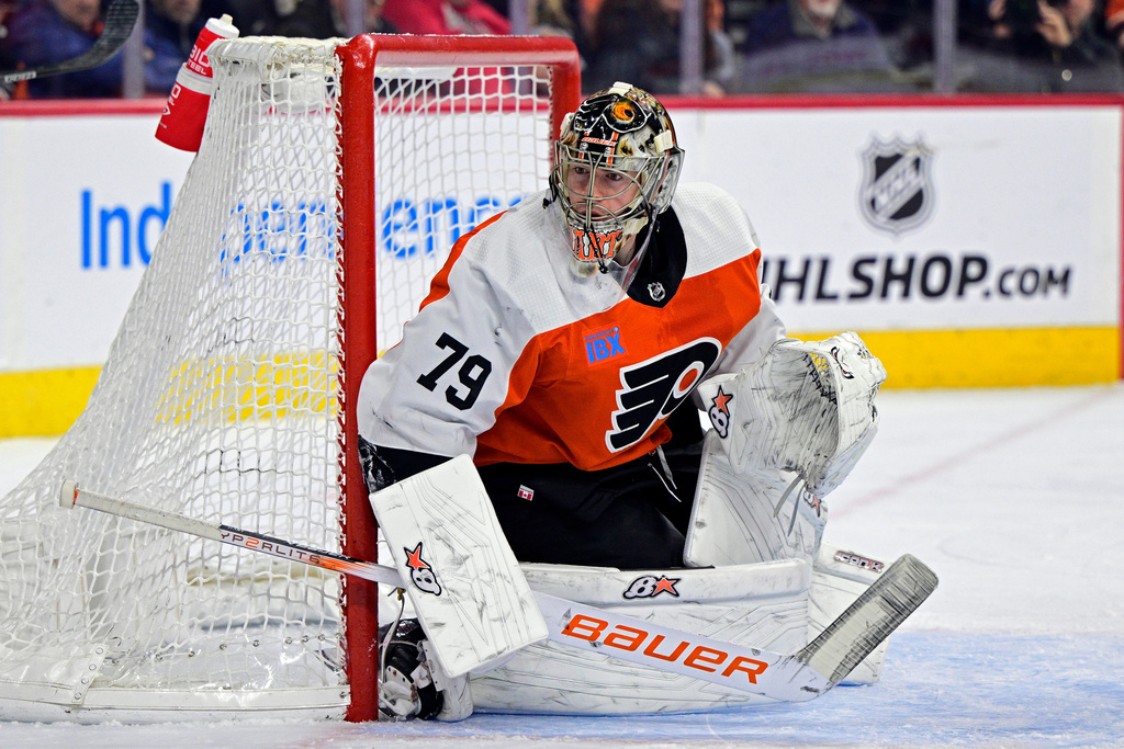 FILE - Philadelphia Flyers' goaltender Carter Hart guards the net during an NHL hockey game against the Colorado Avalanche, Jan. 20, 2024, in Philadelphia. (AP Photo/Derik Hamilton, File)