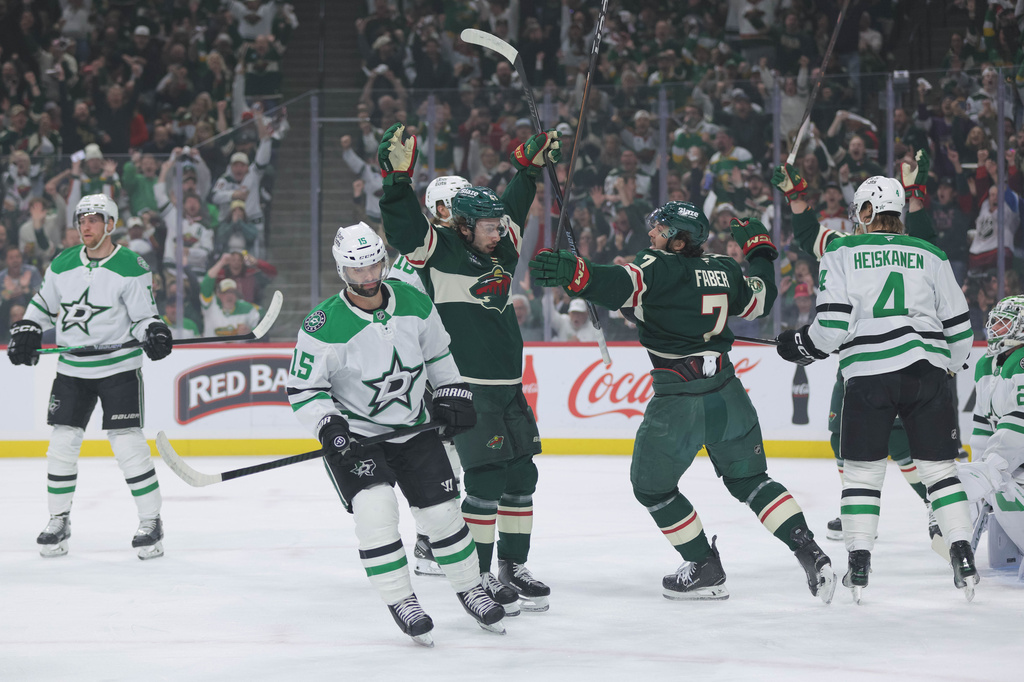 Minnesota Wild defenseman Quinn Hughes (43) celebrates after scoring against Dallas Stars goaltender Jake Oettinger during the first period of Game 6 in the first round of the NHL hockey Stanley Cup playoff series Thursday, April 30, 2026, in St. Paul, Minn. (AP Photo/Bailey Hillesheim)