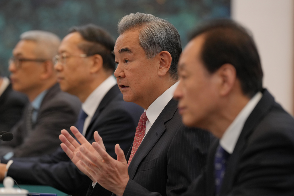 Chinese Foreign Minister Wang Yi, second left, speaks to U.S. Senator Steve Daines and congressional delegation during a bilateral meeting at the Great Hall of the People, in Beijing, Thursday, May 7, 2026. (AP Photo/Andy Wong, Pool)