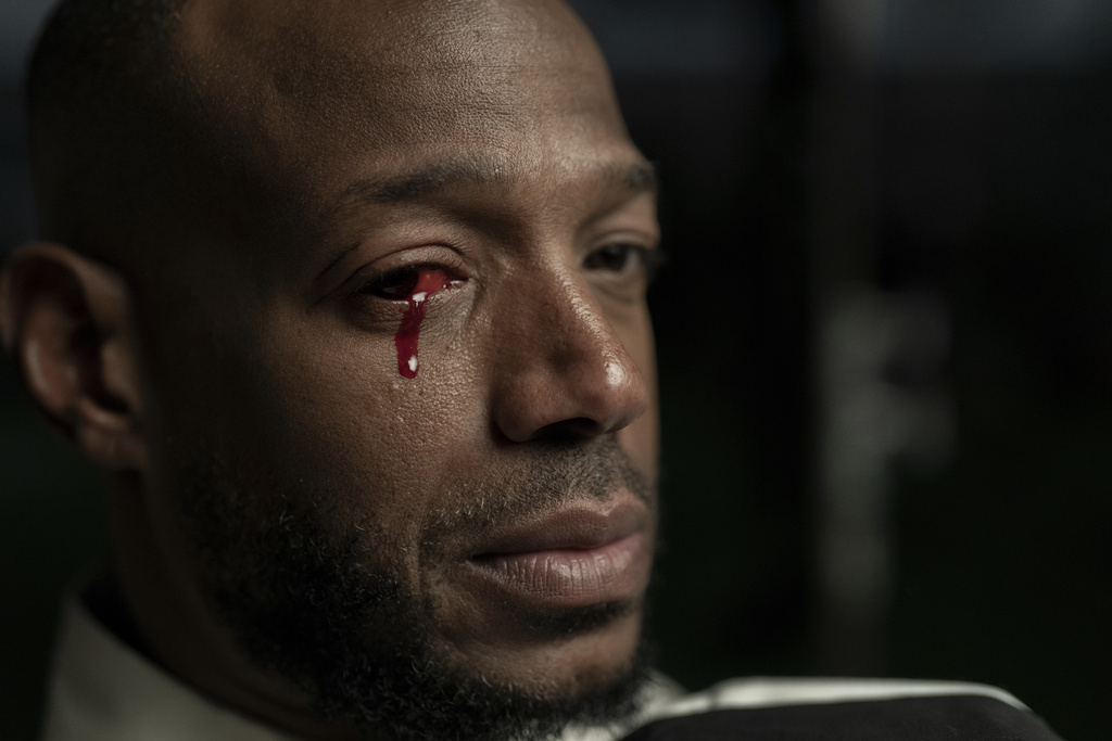 This image released by Universal Pictures shows Marlon Wayans in a scene from "Him." (Universal Pictures via AP)