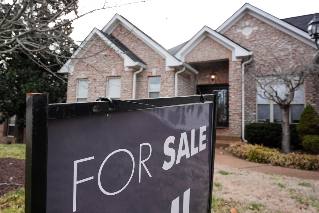 A "for sale" sign is posted outside a home in Nashville, Tenn., on Tuesday, Feb. 10, 2026. (AP Photo/George Walker IV)