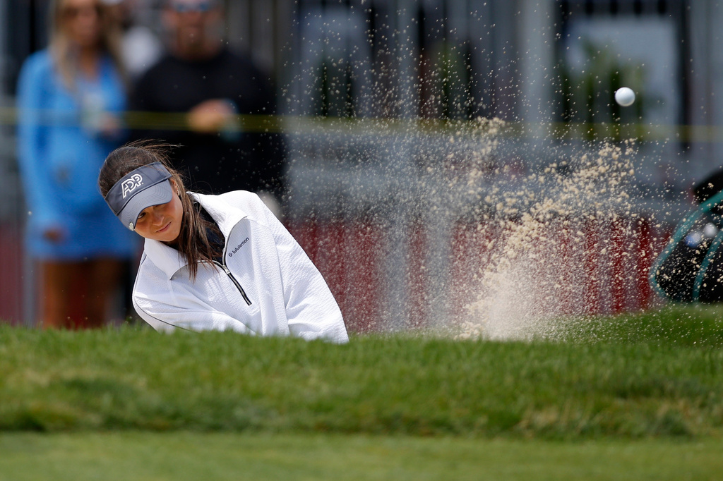 Yana Wilson hits out of a bunker on the eighth hole during the first round of the Meijer LPGA Classic golf tournament, Thursday, June 18, 2026, in Belmont, Mich. (AP Photo/Al Goldis)