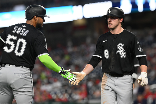 Chicago White Sox' Kyle Teel, right, is greeted by Lenyn Sosa after he scored on a double by Brooks Baldwin during the first inning of a baseball game against the Washington Nationals, Friday, Sept. 26, 2025, in Washington. (AP Photo/Nick Wass) Chicago White Sox' Kyle Teel, right, is greeted by Lenyn Sosa after he scored on a double by Brooks Baldwin during the first inning of a baseball game against the Washington Nationals, Friday, Sept. 26, 2025, in Washington. (AP Photo/Nick Wass)