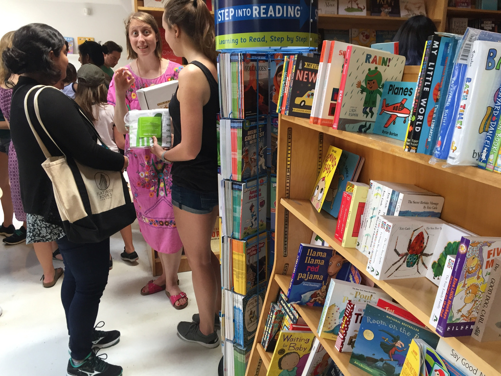 FILE - Author Emma Straub, center, chats with customers on the opening day for the new Books are Magic bookstore in Brooklyn, New York, on April 29, 2017. (AP Photo/Beth J. Harpaz, File)