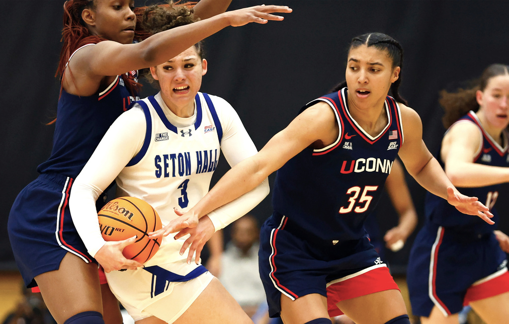 UConn guard Blanca Quinonez (4) and UConn guard Azzi Fudd (35) defend against Seton Hall forward Natalia Hall-Rosa (3) during the second half of an NCAA college basketball game, Saturday, Jan. 24, 2026, in South Orange, N.J. (AP Photo/Noah K. Murray)