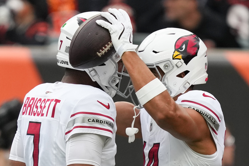 Arizona Cardinals wide receiver Michael Wilson, right, celebrates with teammates after scoring a touchdown during the first half of an NFL football game against the Cincinnati Bengals, Sunday, Dec. 28, 2025, in Cincinnati. (AP Photo/Joshua A. Bickel)