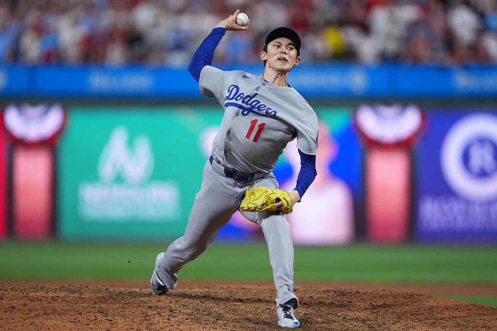 Los Angeles Dodgers' Roki Sasaki pitches during the ninth inning in Game 1 of baseball's National League Division Series against the Philadelphia Phillies, Saturday, Oct. 4, 2025, in Philadelphia. (AP Photo/Matt Rourke)