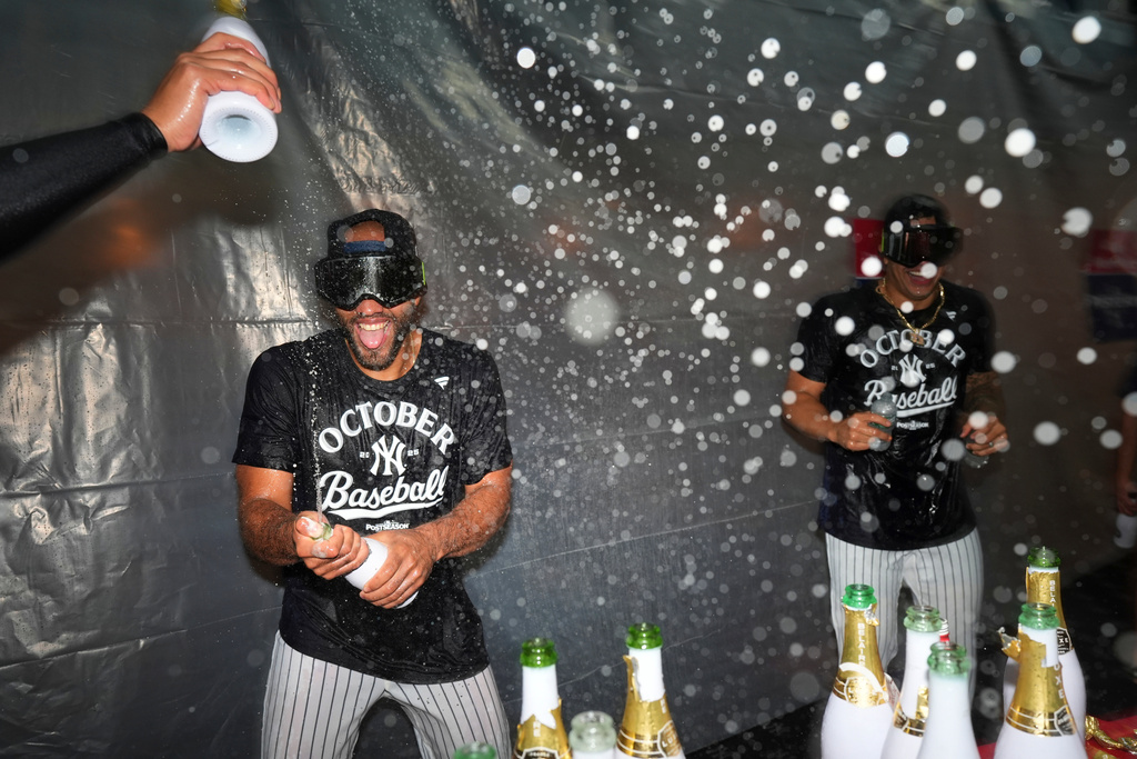 The New York Yankees celebrate after they clinched playoff berth a baseball game against the Chicago White Sox Tuesday, Sept. 23, 2025, in New York. (AP Photo/Frank Franklin II)