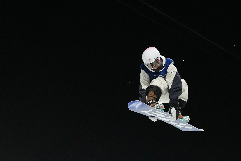 Japan's Yuto Totsuka competes during the men's snowboarding halfpipe finals at the 2026 Winter Olympics, in Livigno, Italy, Friday, Feb. 13, 2026. (AP Photo/Lindsey Wasson)