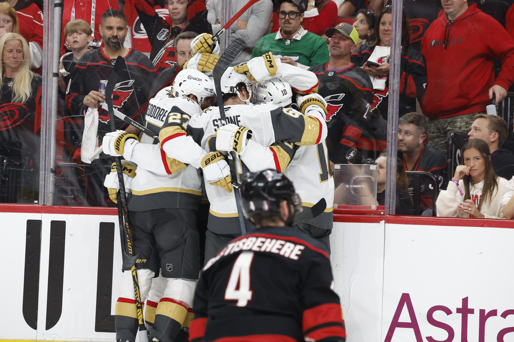 Vegas Golden Knights celebrate a goal by Tomas Hertl, during the third period in Game 1 of the NHL hockey Stanley Cup Final series against the Carolina Hurricanes in Raleigh, N.C., Tuesday, June 2, 2026. (AP Photo/Karl DeBlaker)