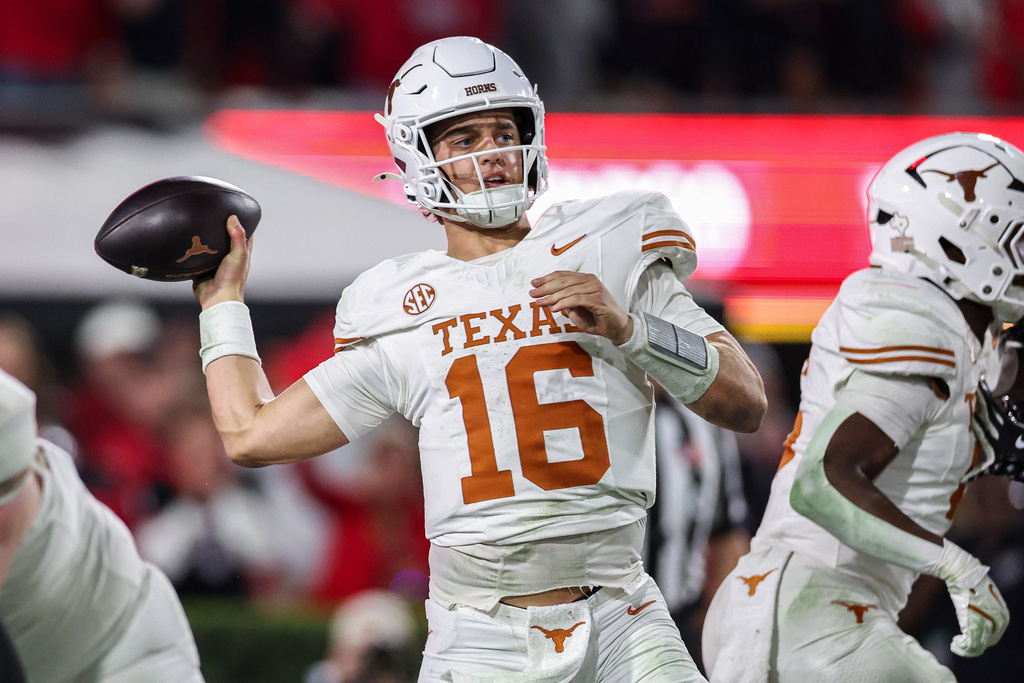 Texas quarterback Arch Manning (16) looks to throw a pass during the second half of an NCAA college football game against Georgia, Saturday, Nov. 15, 2025, in Athens, Ga. (AP Photo/Colin Hubbard)