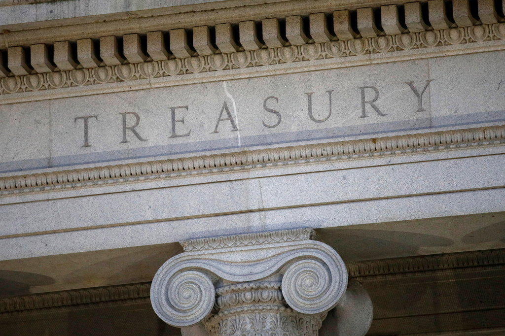 FILE - The Treasury Department building is pictured at dusk in Washington, June 6, 2019. (AP Photo/Patrick Semansky, File)