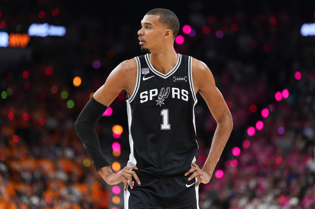 San Antonio Spurs forward Victor Wembanyama (1) looks to his bench during the first half of Game 1 of the NBA Finals basketball series against the New York Knicks, Wednesday, June 3, 2026, in San Antonio. (AP Photo/Eric Gay)