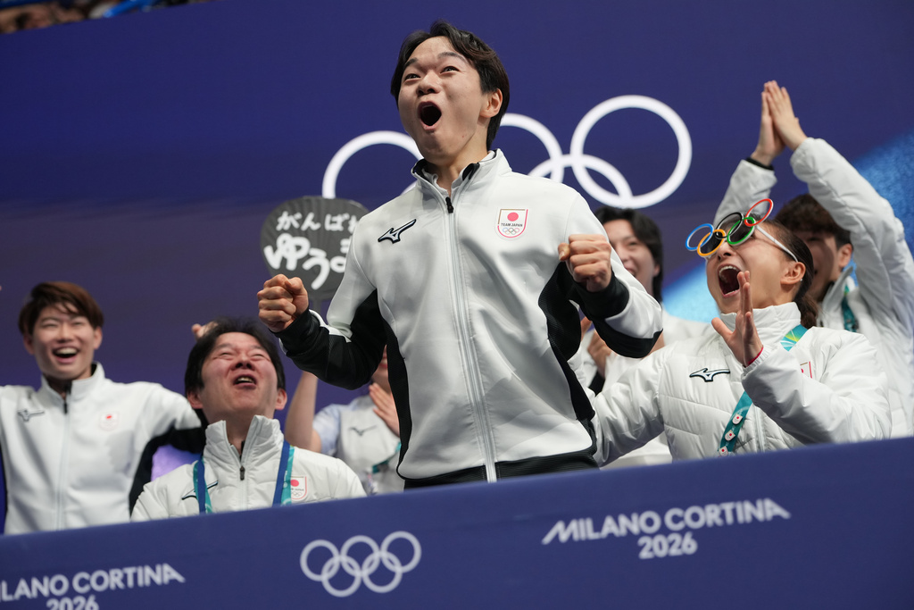 Yuma Kagiyama of Japan reacts to his scores after competing during the figure skating men's team event at the 2026 Winter Olympics, in Milan, Italy, Saturday, Feb. 7, 2026. (AP Photo/Francisco Seco)