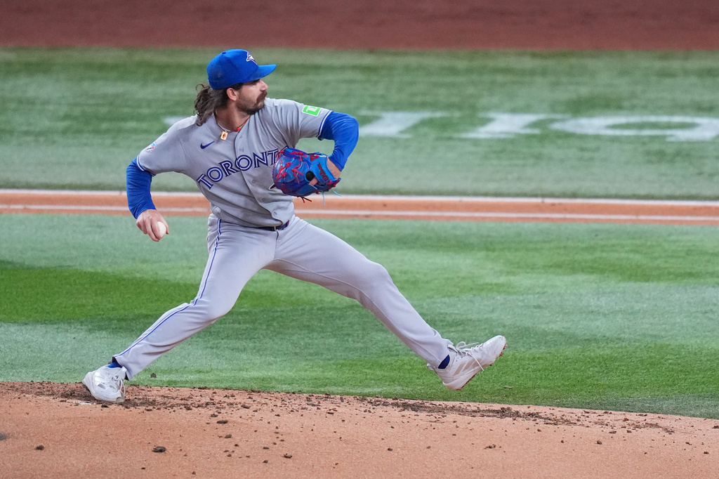 Toronto Blue Jays starting pitcher Dylan Cease throws to the Texas Rangers during the second inning of a baseball game Friday, Sept. 18, 2026, in Arlington, Texas. (AP Photo/Julio Cortez)