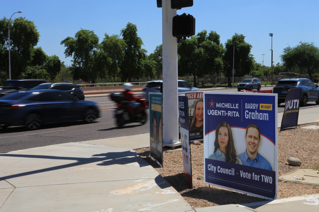 Campaign signs for Scottsdale City Council candidates are posted Wednesday, Sept. 9, 2026 in Scottsdale, Ariz. (AP Photo/Wufei Yu)