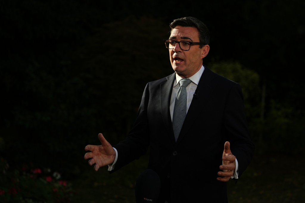 Britain's Prime Minister Andy Burnham speaks to the media after chairing a COBR meeting at Downing Street on the UK's ongoing response to extreme heat, wildfires and drought in London, Wednesday, Aug. 12, 2026.(AP Photo/Kin Cheung, Pool)