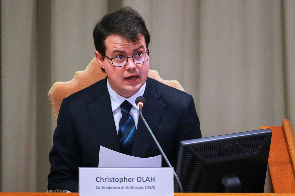Anthropic co-founder Christopher Olah speaks during the presentation of Pope Leo XIV's first encyclical, "Magnifica humanitas: On Safeguarding the Human Person in the Time of Artificial Intelligence," at the Vatican, Monday, May 25, 2026. (AP Photo/Alessandra Tarantino)