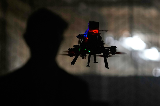 Colin Balfour, a sophomore studying robotics engineering, flies a small drone at a simulated night flight at a laboratory at the Worcester Polytechnic Institute, Monday, Oct. 20, 2025, in Worcester, Mass. (AP Photo/Charles Krupa) Colin Balfour, a sophomore studying robotics engineering, flies a small drone at a simulated night flight at a laboratory at the Worcester Polytechnic Institute, Monday, Oct. 20, 2025, in Worcester, Mass. (AP Photo/Charles Krupa)