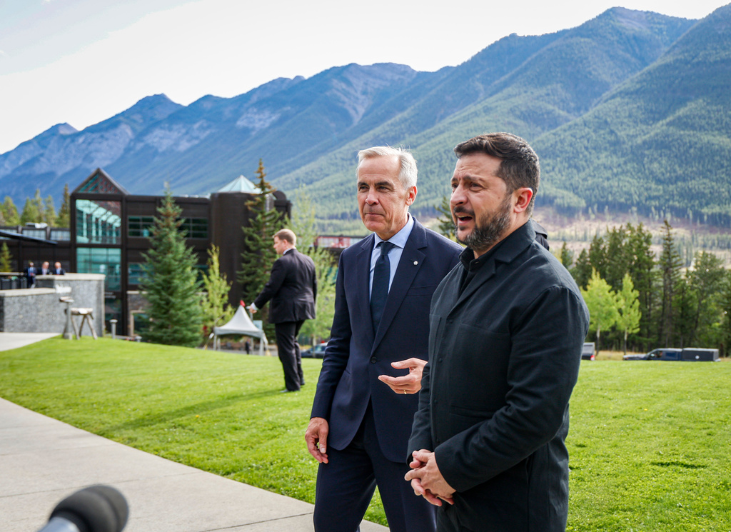 Canada's Prime Minister Mark Carney, left, and President of Ukraine Volodymyr Zelenskyy, speak to the media in Banff, Alta., Thursday, Sept. 10, 2026. (Jeff McIntosh/The Canadian Press via AP)