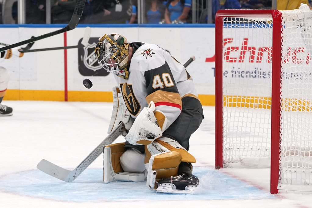 Vegas Golden Knights goaltender Akira Schmid watches the puck during the second period of an NHL hockey game against the St. Louis Blues Saturday, Nov. 15, 2025, in St. Louis. (AP Photo/Jeff Roberson)