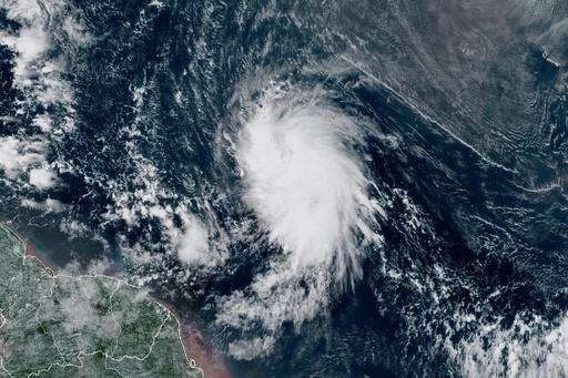 This satellite image provided by the National Oceanic and Atmospheric Administration (NOAA) shows Tropical Storm Jerry in the Atlantic Ocean, Tuesday, Oct. 7, 2025. (NOAA via AP) This satellite image provided by the National Oceanic and Atmospheric Administration (NOAA) shows Tropical Storm Jerry in the Atlantic Ocean, Tuesday, Oct. 7, 2025. (NOAA via AP)