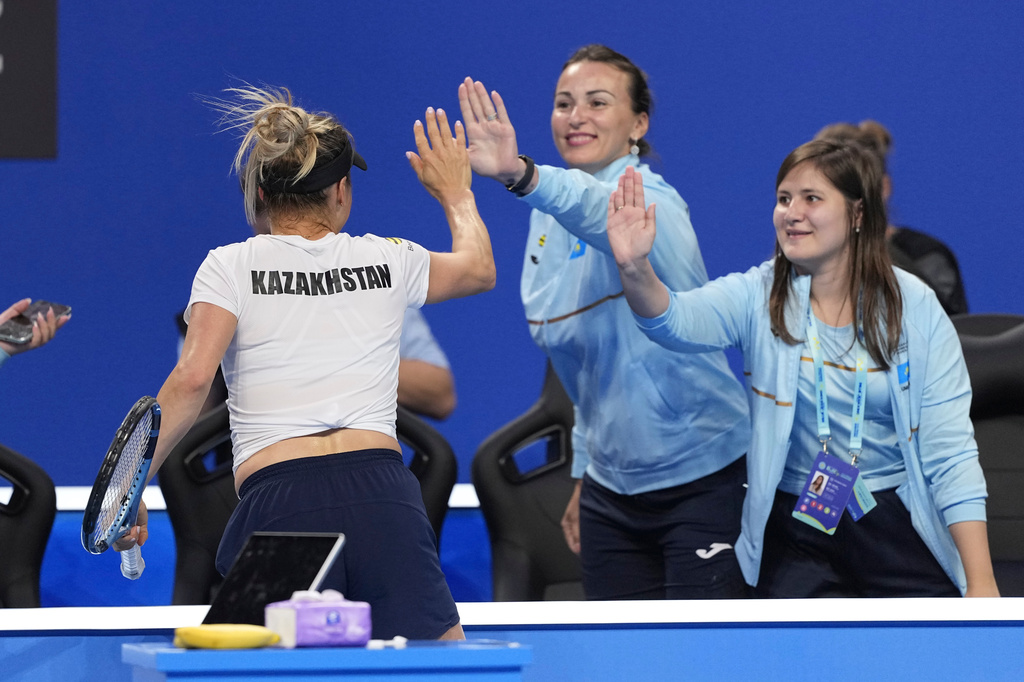 Kazakhstan's Yulia Putintseva celebrates after defeating Spain's Cristina Bucsa during a quarterfinal match for the Billie Jean King Cup held in Shenzhen in southern China's Guangdong province, Wednesday, Sept. 23, 2026. (AP Photo/Andy Wong)
