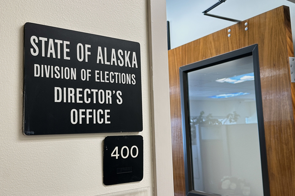 FILE - A sign hangs outside the director's office of the Alaska Division of Elections, March 19. 2026, in Juneau, Alaska. (AP Photo/Becky Bohrer, File)