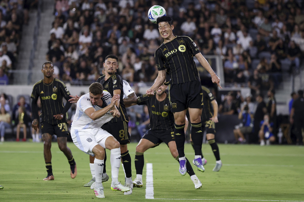 Los Angeles FC forward Son Heung-Min, front right, heads the ball during the first half of an MLS soccer match against San Diego FC, Sunday, Aug. 31, 2025, in Los Angeles, Calif. (AP Photo/Eric Thayer)