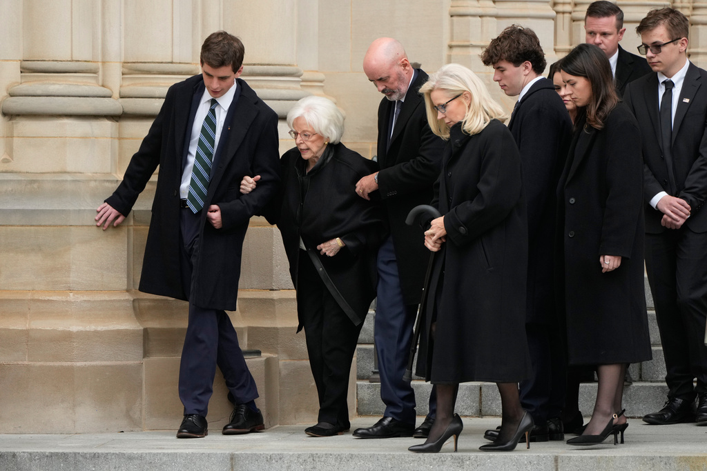 Wife of former Vice President Dick Cheney, Lynne Cheney second left, is escorted along with daughter, former Rep. Liz Cheney, R-Wyo., fourth left, and family after a memorial service for former Vice President Dick Cheney at the Washington National Cathedral, Thursday, Nov. 20, 2025, in Washington. (AP Photo/Mark Schiefelbein)