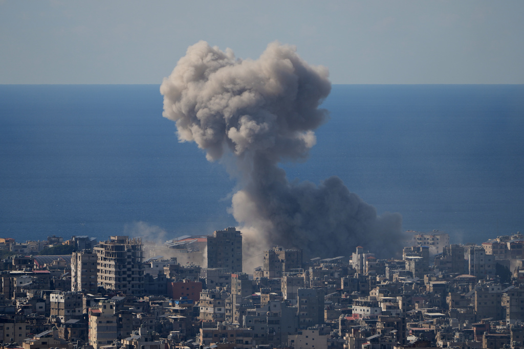 Smoke rise from an Israeli airstrike in Dahiyeh, Beirut's southern suburbs, Monday, March 9, 2026. (AP Photo/Hassan Ammar)