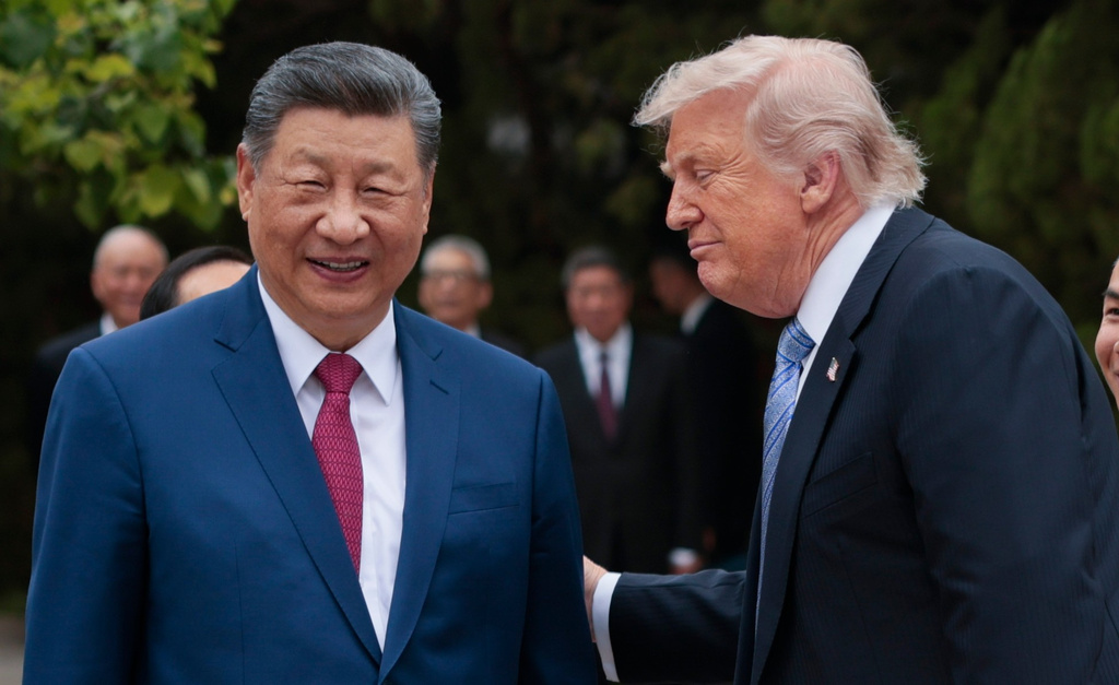 U.S. President Donald Trump, right, speaks with Chinese President Xi Jinping while leaving after a visit to the Zhongnanhai Garden in Beijing, Friday, May 15, 2026. (Evan Vucci/Pool Photo via AP)