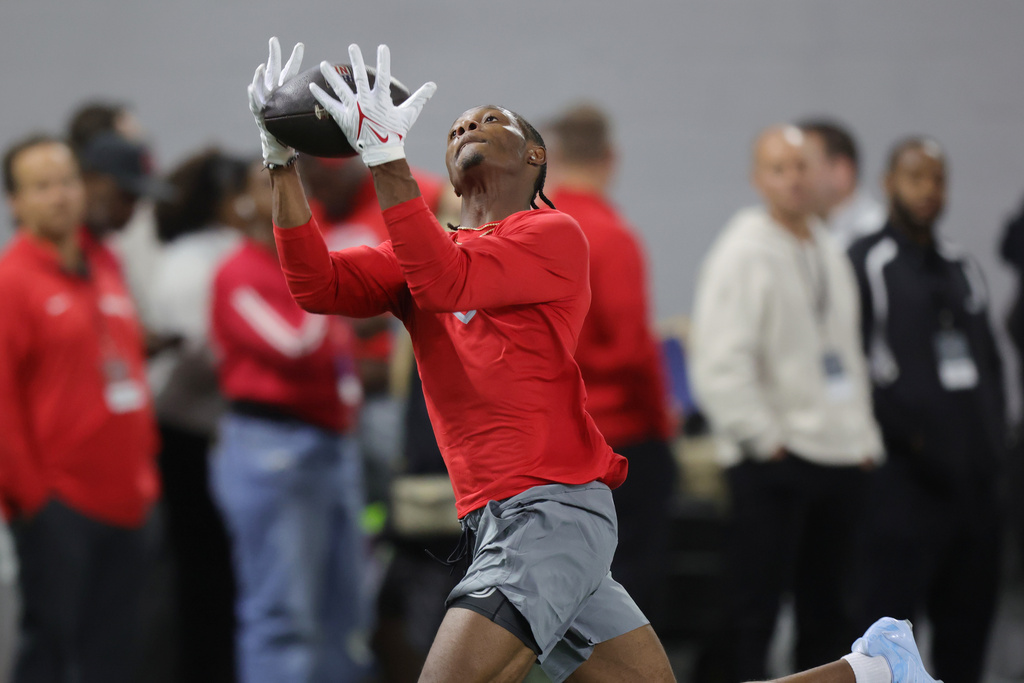 Ohio State wide receiver Carnell Tate makes a catch during the school's NFL football pro day, Wednesday, March 25, 2026, in Columbus, Ohio.. (AP Photo/Paul Vernon)