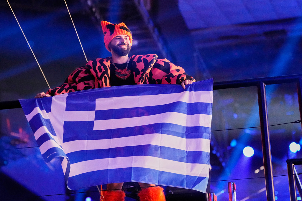 Akylas from Greece who performed the song "Ferto" reacts as the vote totals are announced during the first semifinal of the 70th Eurovision Song Contest in Vienna, Austria, Tuesday, May 12, 2026. (AP Photo/Martin Meissner)