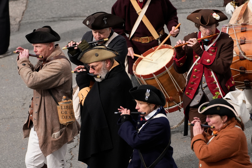 Members of a fife and drum band march in a procession during an Evacuation Day ceremony marking the 1776 departure of British troops from the city during the American Revolutionary War, Tuesday, March 17, 2026, in Boston. (AP Photo/Robert F. Bukaty)