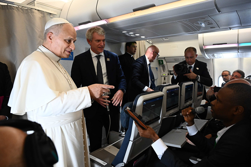 Pope Leo XIV answers journalists' questions during his flight from Yaounde, Cameroon to Luanda, Angola, Saturday, April 18 2026. (Luca Zennaro/Pool Photo via AP)