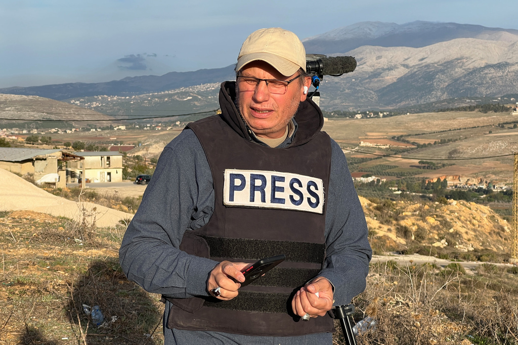 Hezbollah's al-Manar TV correspondent Ali Shoeib, who was killed in an Israeli strike in Jezzine along with other journalists on Saturday, March 28, 2026, is seen reporting in the town of Marjayoun, Wednesday, Nov. 22, 2024. (AP Photo/Hussein Malla)