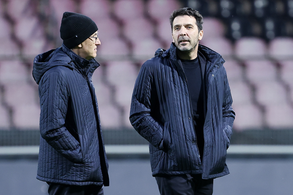 Italy's Gianluigi Buffon, right, walks on the pitch ahead of Tuesday's World Cup playoff final soccer match against Bosnia, at the Bilino Polje stadium, in Zenica, Bosnia, Monday, March 30, 2026. (AP Photo/Armin Durgut)