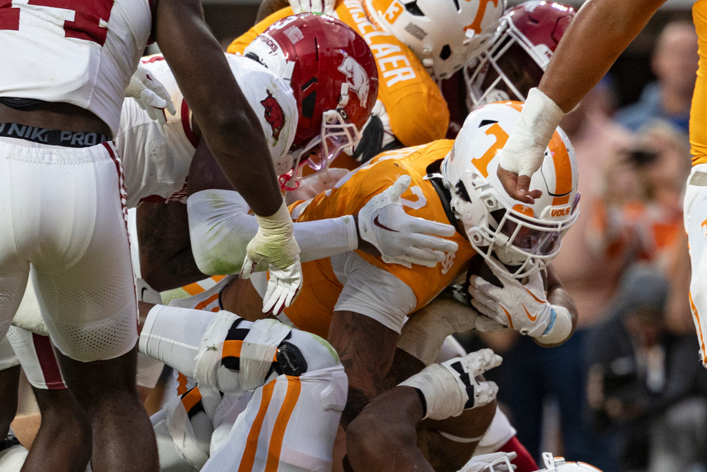 Tennessee running back Peyton Lewis (2) crosses the goal line for a touchdown during the second half of an NCAA college football game against Arkansas, Saturday, Oct. 11, 2025, in Knoxville, Tenn. (AP Photo/Wade Payne)